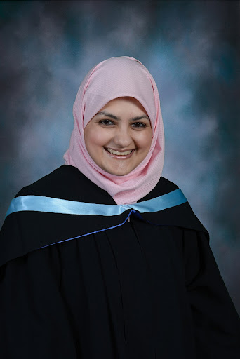 Fatima Ahmed sits and smiles.